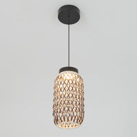 The Artika Benson Mini LED pendant light 5 CCT features a cylindrical rattan weave shade and black cord, suspended against a white background to emit a warm, soft glow.