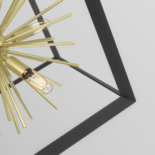 Close-up of the Artika Nebula 6-light pendant, featuring gold spikes and exposed bulbs in a geometric black metal frame, set against a plain white background.