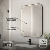 A modern bathroom with a rectangular LED mirror featuring integrated defogger and touch functions, above a white sink with a black faucet. Text highlights the mirror’s features and a 5-year warranty icon is shown.