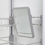 A close-up of a rectangular mirror with a grey frame mounted on a metal bathroom shelf unit. The mirror is attached with metal brackets and slightly angled to the side.