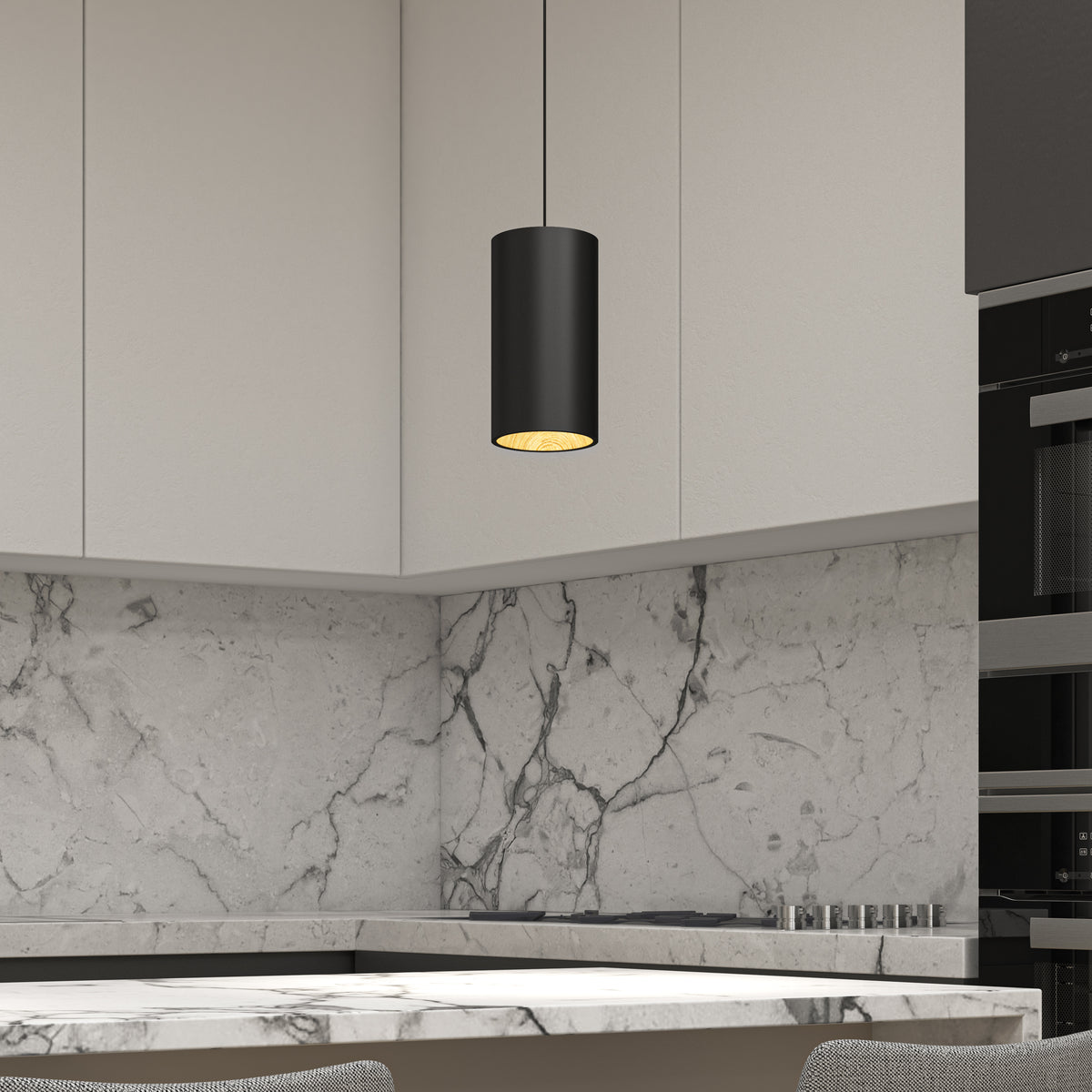 Modern kitchen with marble backsplash and countertop, light gray cabinets, built-in black appliances, and an Artika Alton mini LED pendant light 5 CCT hanging above. Two textured chairs are partially visible in the foreground.