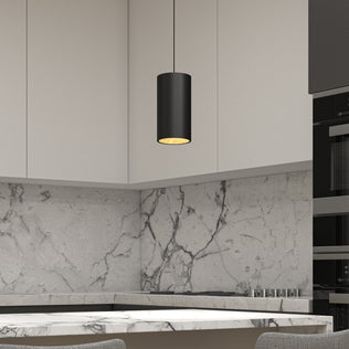 Modern kitchen with marble backsplash and countertop, light gray cabinets, built-in black appliances, and an Artika Alton mini LED pendant light 5 CCT hanging above. Two textured chairs are partially visible in the foreground.