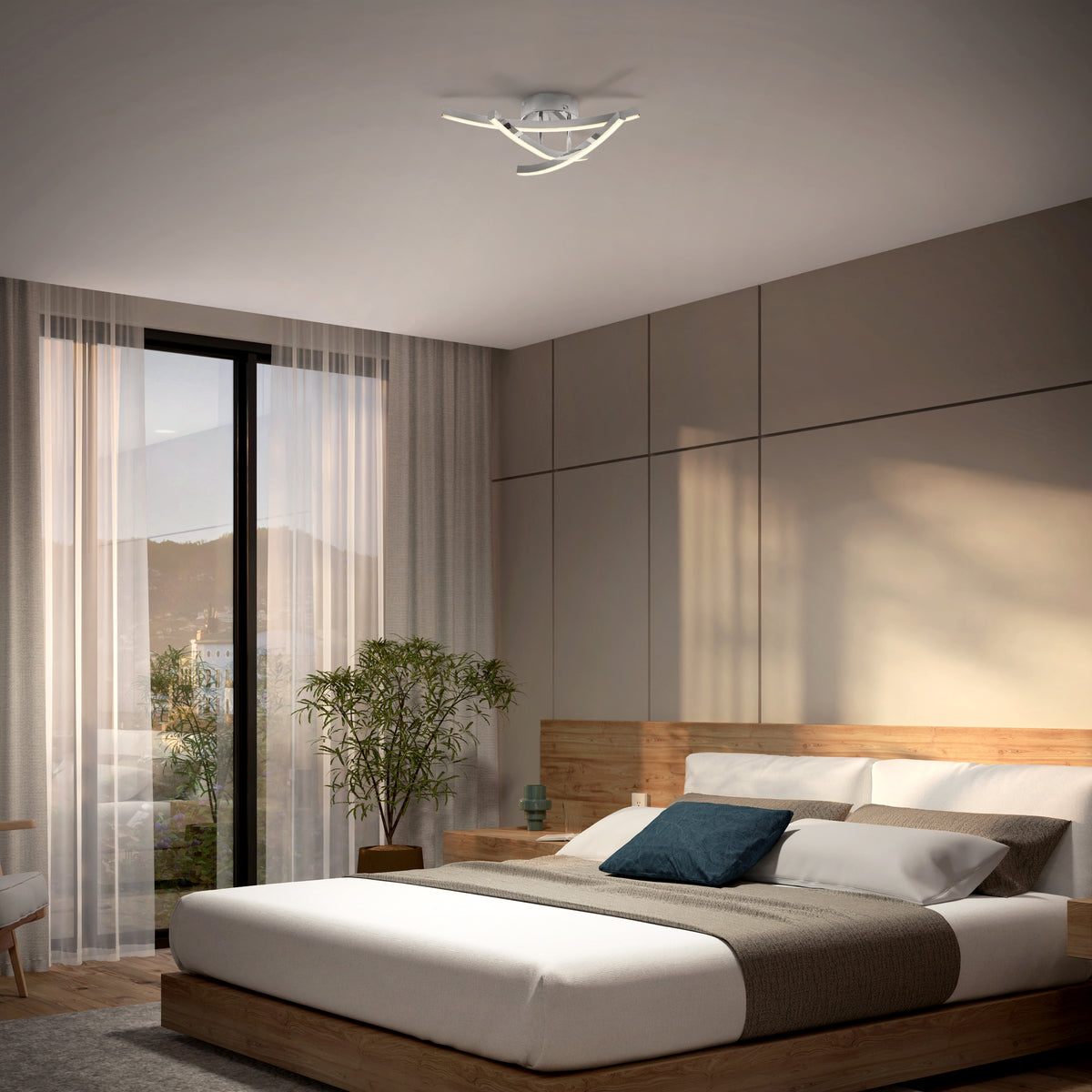 Modern bedroom with a large bed, wooden headboard, gray and white bedding, a potted plant, floor-to-ceiling window with sheer curtains, and a contemporary ceiling light fixture.