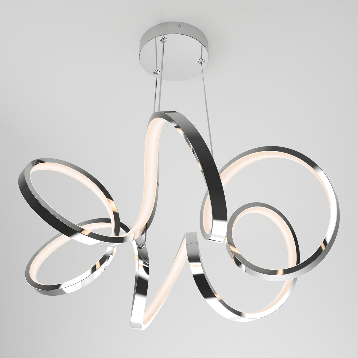 Modern ceiling light fixture with intertwined, looping metal bands and integrated LED strips, suspended by two cables from a round chrome base, against a plain white ceiling background.
