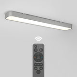 A modern, rectangular wall-mounted LED light is shown above a remote control with various buttons and a wireless signal icon between them, indicating remote operation. The light emits a soft, even glow.
