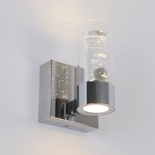The Artika Essence 1-light LED vanity light features a chrome base and bubble glass, ideal for accenting any white wall.
