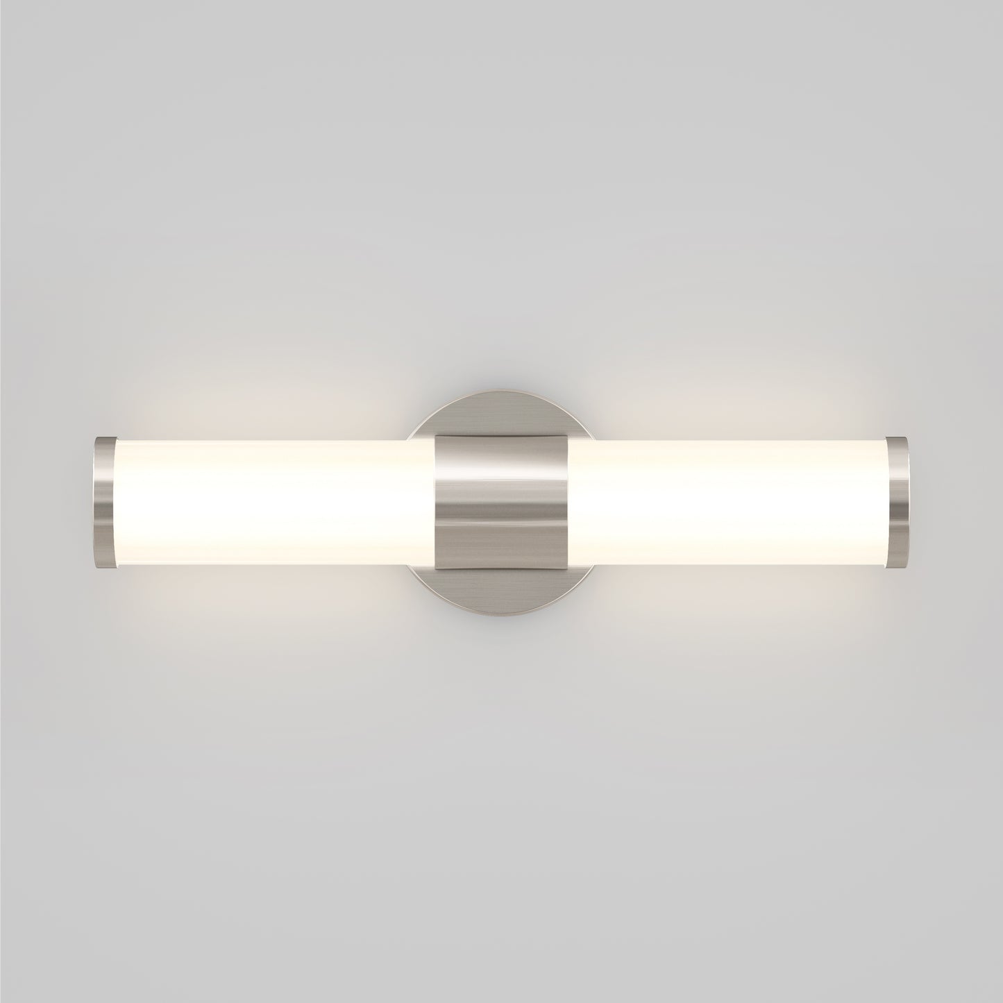 The Artika Adina Modern Bathroom Vanity Light 3 CCT features a cylindrical frosted glass shade with metallic end caps, mounted on a circular base and emits soft white light, perfect for any contemporary space.