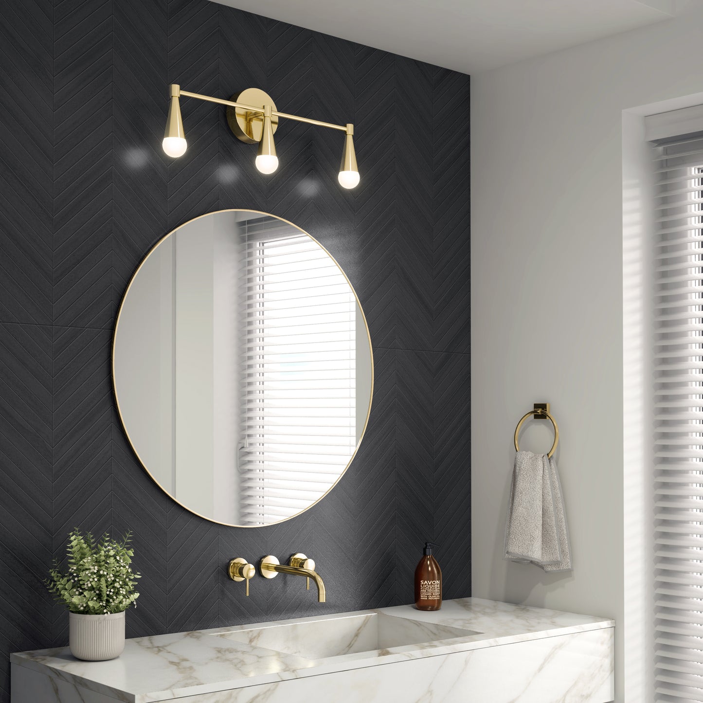 A modern bathroom features a round mirror, Artika’s Wayden LED mid-century vanity light, a gold faucet, chevron-patterned wall, marble sink, potted plant, soap dispenser, and a hand towel on a gold ring by the window.