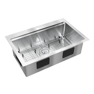 The Artika Newport 33 in. single bowl stainless steel workstation sink features a rectangular basin, center drain, bottom metal rack, pre-drilled faucet hole on the back edge, and visible black soundproofing pads on the sides.