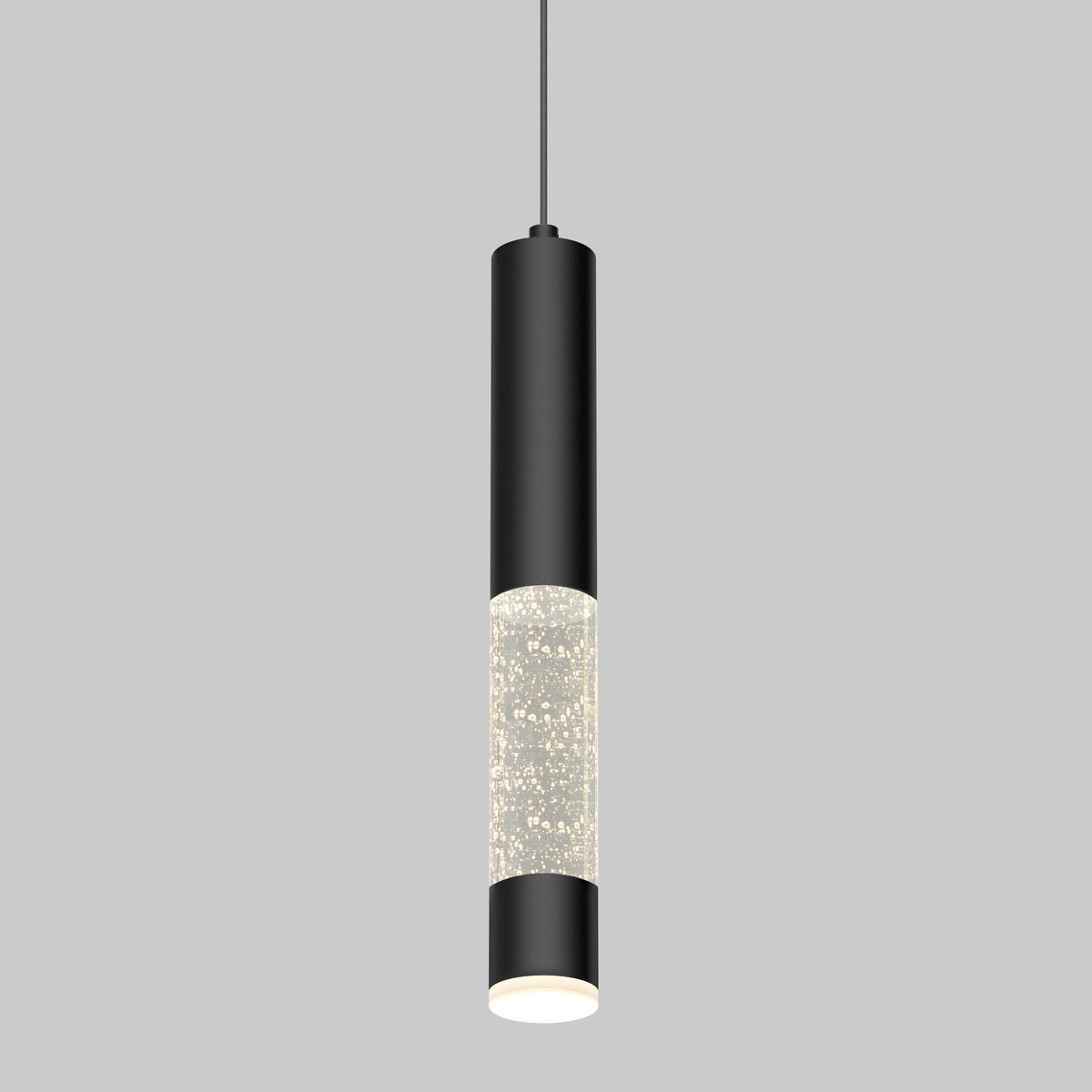 A modern pendant light with a cylindrical black metal body and a clear section filled with small bubbles, suspended from a thin black cord against a plain gray background.