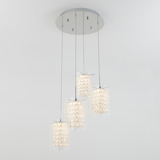 The Artika Crystal Cube 4-light LED pendant features four cylindrical lights, each in clear textured glass, suspended at varied lengths from a round metallic base for a modern look.