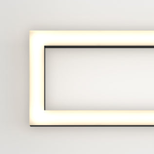 The image shows the left half of the Artika Dover 27-in Integrated LED 5-CCT Vanity Light Bar, featuring a sleek chrome finish and rounded corners, mounted on a white wall and emitting a soft, even glow.