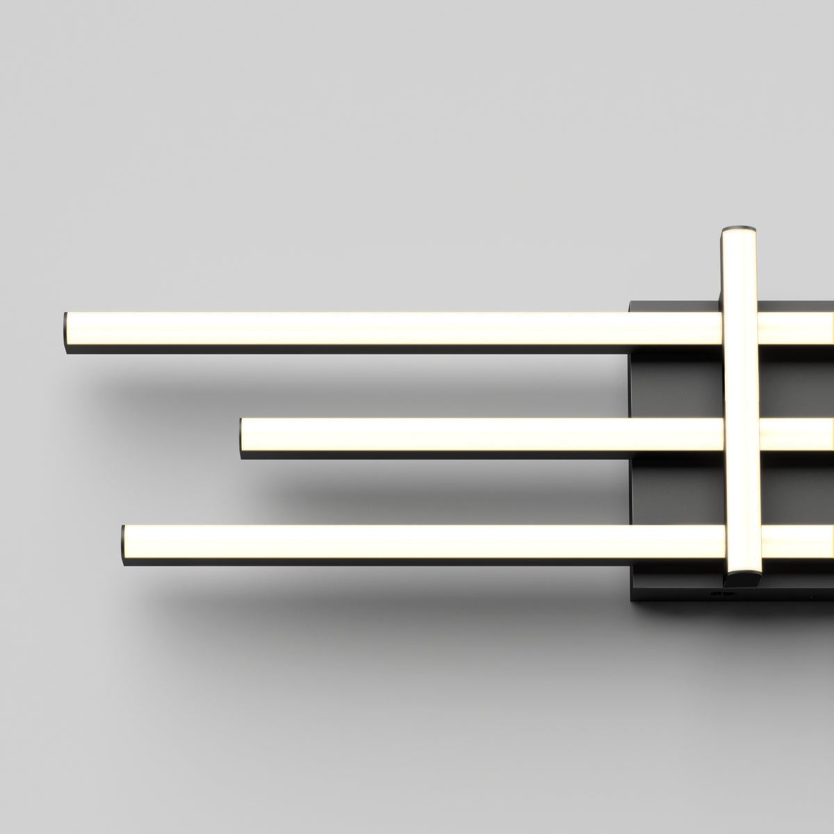 A modern wall light fixture with three horizontal, parallel, glowing LED bars attached to a black rectangular base against a plain light gray background.