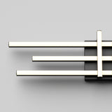 A modern wall light fixture with three horizontal, parallel, glowing LED bars attached to a black rectangular base against a plain light gray background.