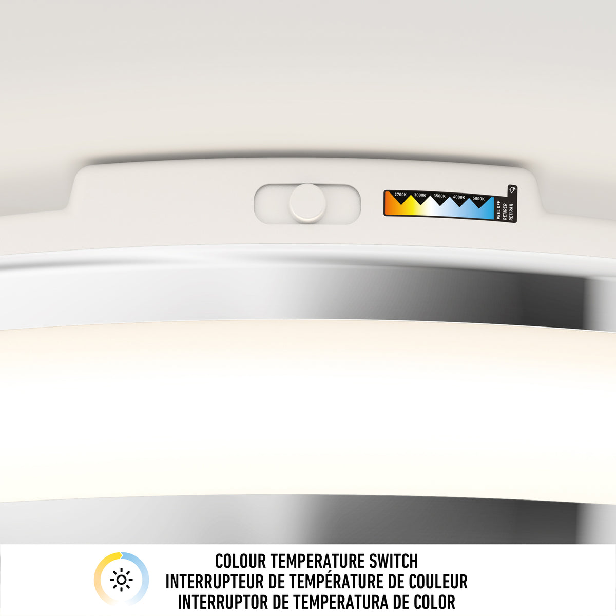 Close-up of the colour temperature switch on the Artika Hemisphere 15 in. LED flush mount light 5 CCT, with a label for yellow, white, and blue settings. "Colour Temperature Switch" is displayed in three languages—ideal for adjustable brightness.