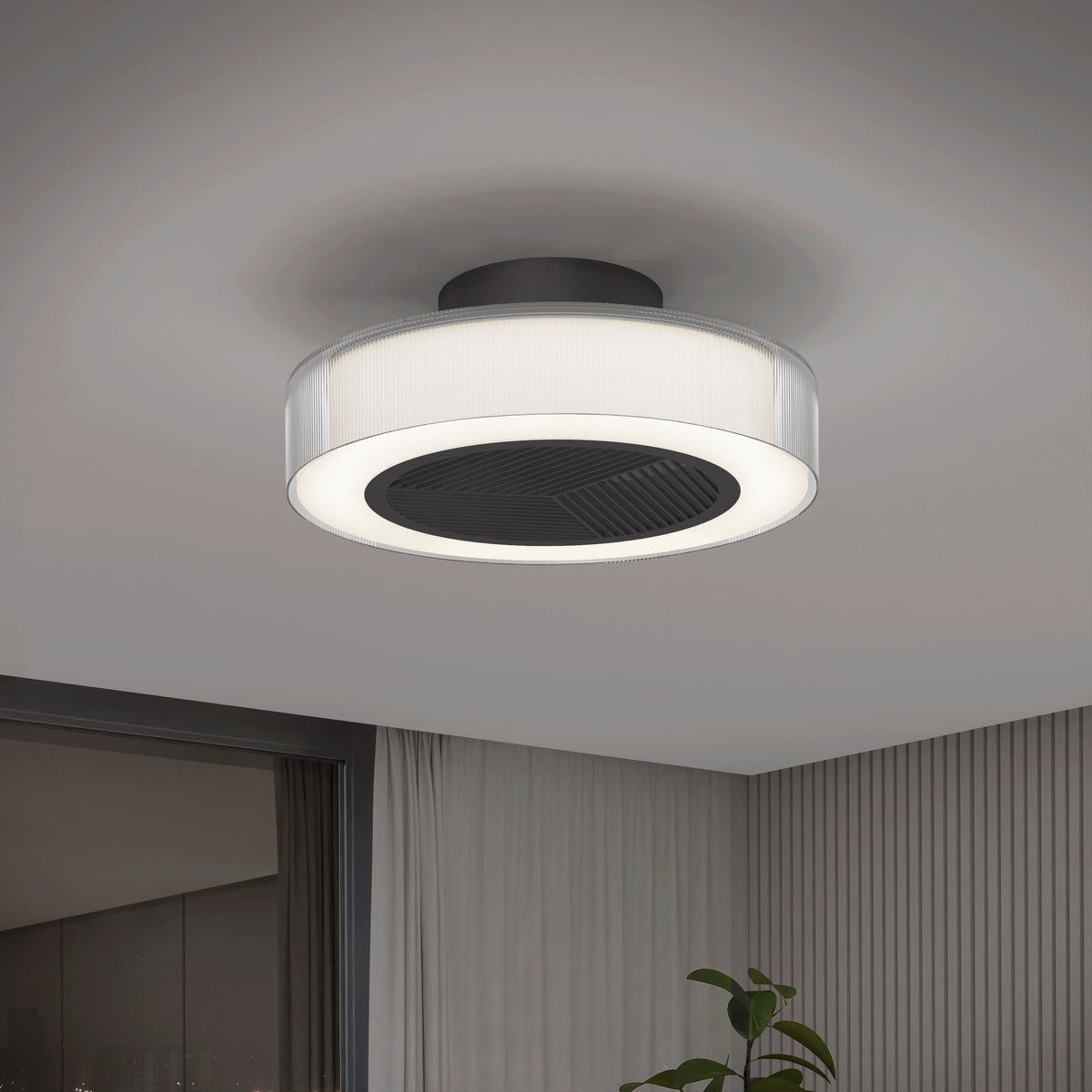 The Artika Groove 20 in. LED modern ceiling fan features a circular design with a black center and white outer ring, mounted on a white ceiling above a stylish room with light gray walls and a plant in the corner. Includes remote and 3 speeds.