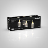 A black box featuring a gold and clear three-light vanity fixture by Artika, called Champagne Globe, with product details and images of the light fixture on the packaging.