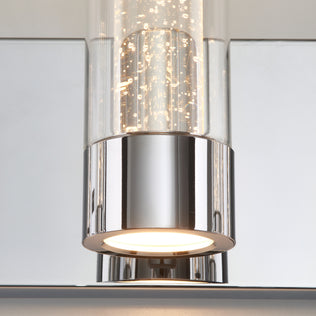 Close-up of the Artika Essence 27-in LED Vanity Light, featuring a chrome frame and clear glass, emitting a soft white glow.