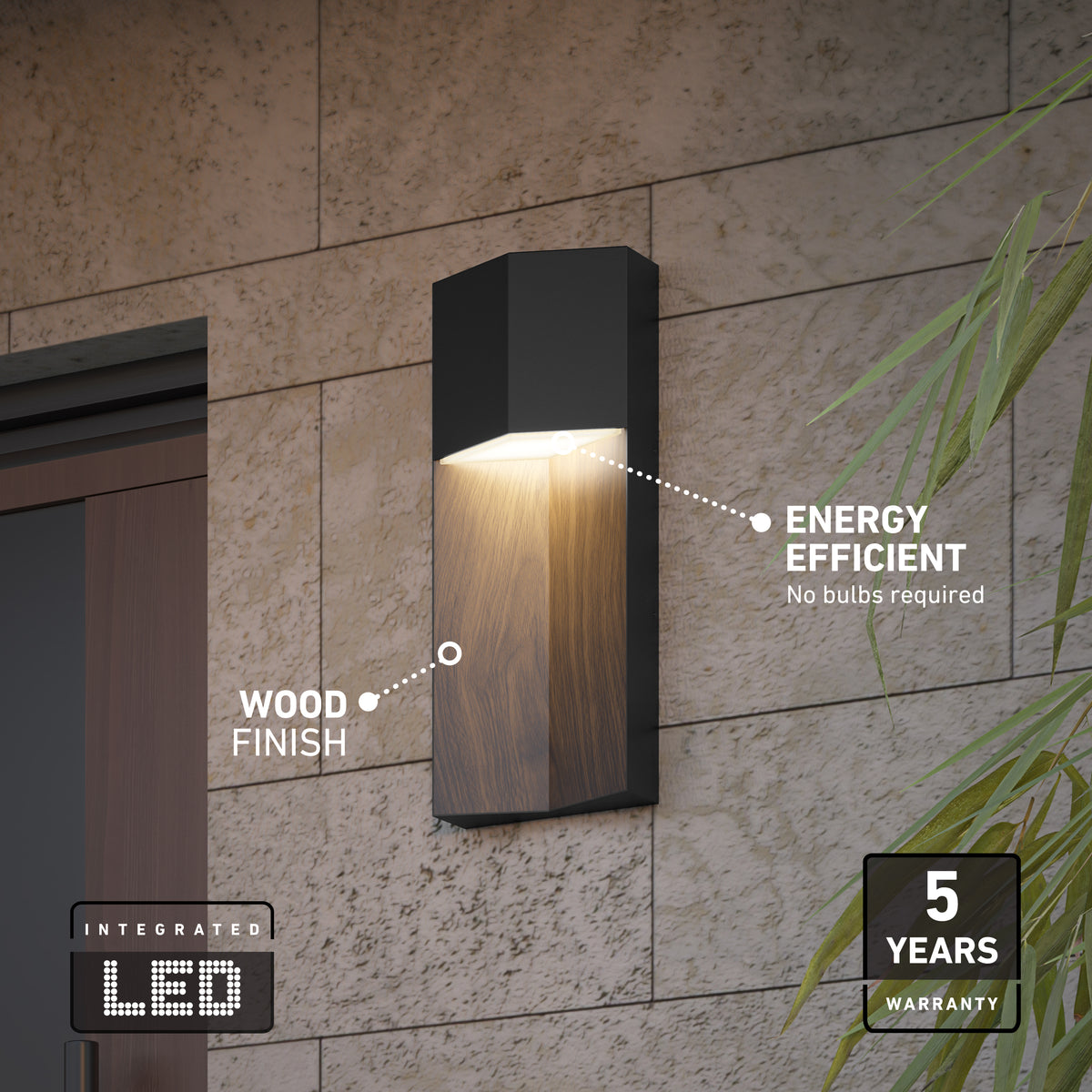 A modern black and wood-finish wall light is mounted on a stone wall, labeled as energy efficient with integrated LED and a 5-year warranty. Green plant leaves are visible on the right side.