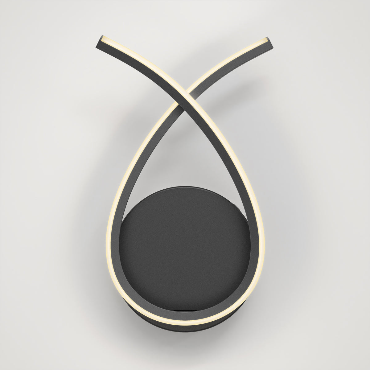 A modern wall lamp with two curved, black arms crossing at the top, each outlined with a soft white LED light, mounted on a circular black base against a plain white background.