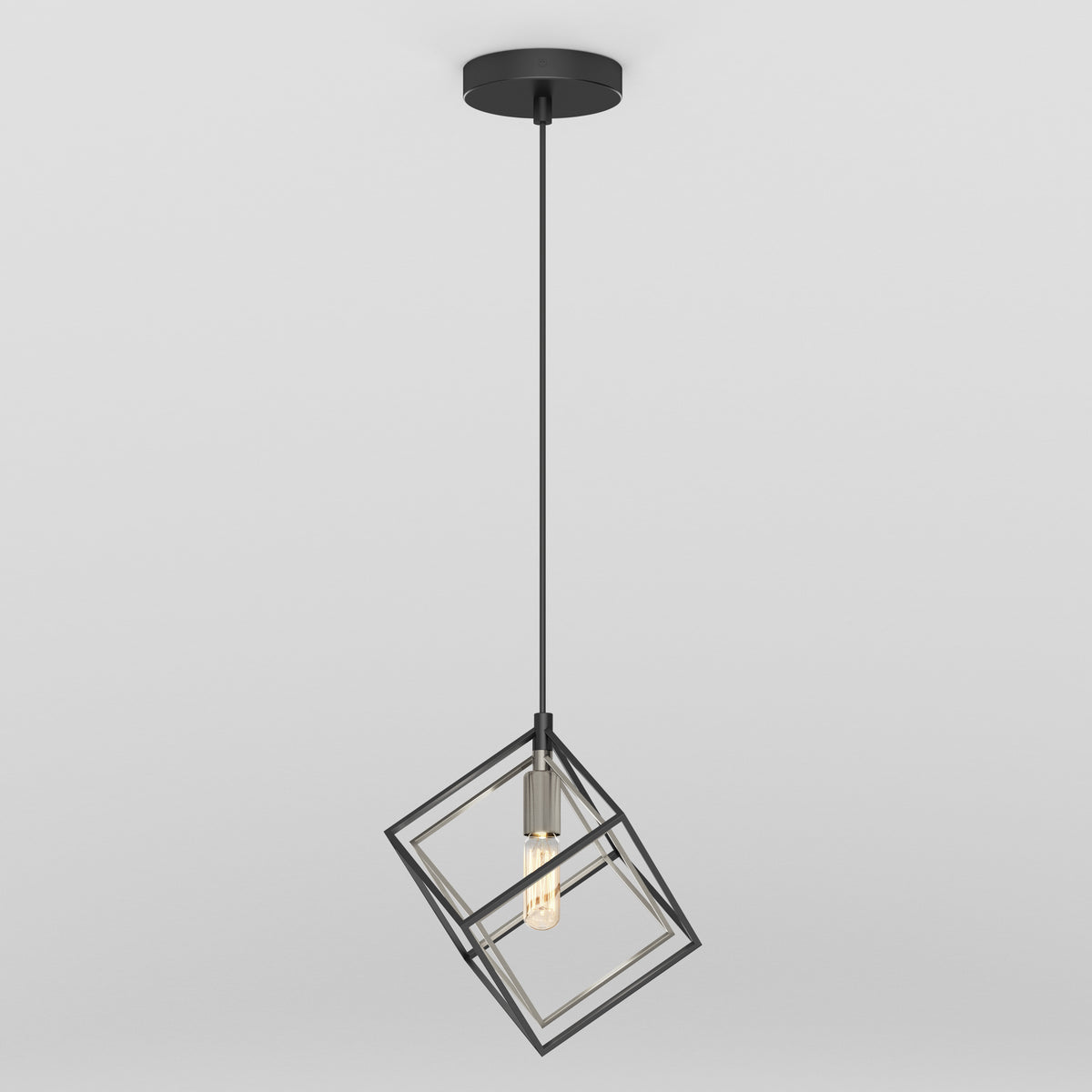 A modern pendant light with a black cord and a geometric, open cube-shaped metal frame surrounding an exposed light bulb, hanging from a round ceiling mount against a plain white background.