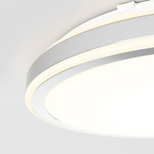 Close-up of the Artika Altitude 15 in. LED modern flush mount light, featuring a glowing white ring, smooth minimalist design, and 5 adjustable colour temperatures, mounted on a light gray ceiling.