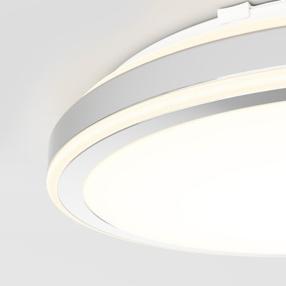 Close-up of the Artika Altitude 15 in. LED modern flush mount light, featuring a glowing white ring, smooth minimalist design, and 5 adjustable colour temperatures, mounted on a light gray ceiling.