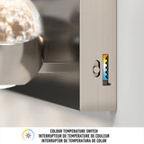 Close-up of a metallic light fixture with a color temperature switch, showing a slider next to a gradient label from warm orange to cool blue. Text below reads: Colour Temperature Switch in three languages.