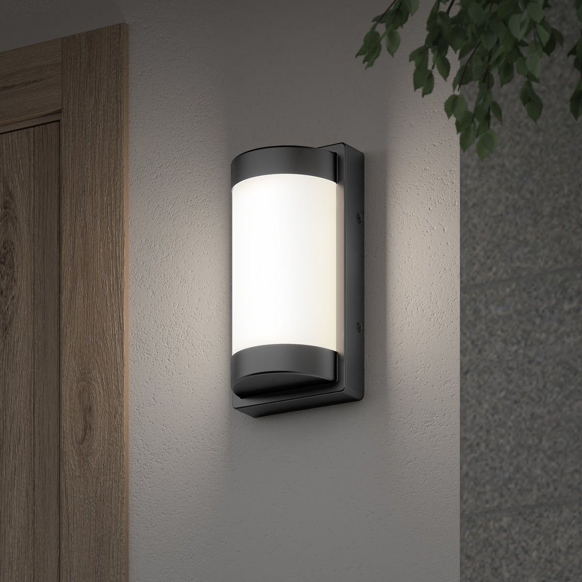 The Artika Fogo modern LED indoor-outdoor wall light 5 CCT is mounted on a light-colored wall near a wooden door, with green leaves in the top right corner.