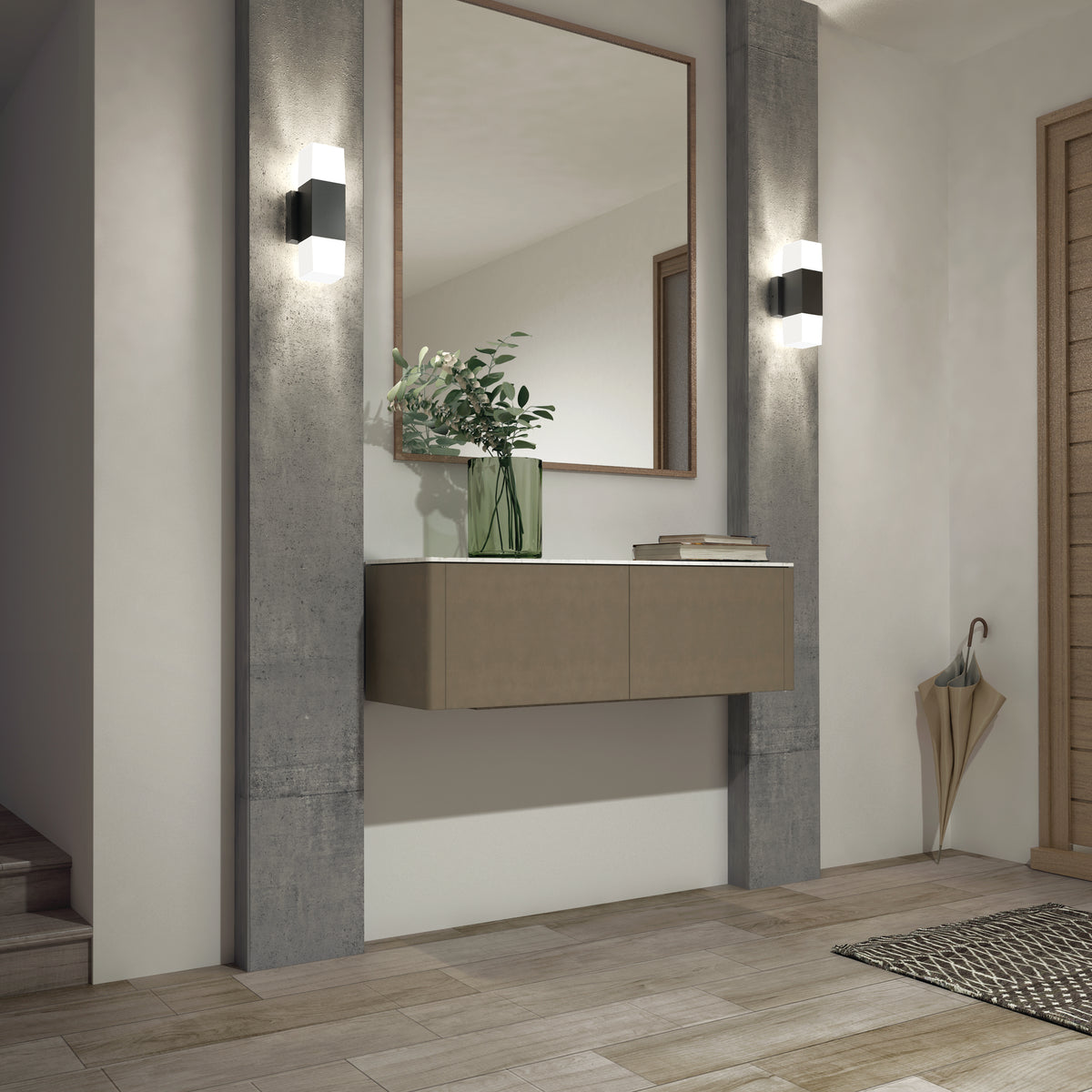 A modern hallway with a floating beige console, a large mirror, wall sconces, a green vase with foliage, wooden floors, and an umbrella in the corner. Light streams in, creating a bright, clean atmosphere.