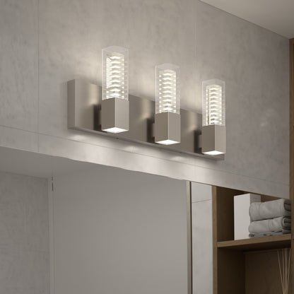 The Artika Hologram LED modern bathroom vanity light 5 CCT features three sleek rectangular lights on a metallic plate, perfect for mounting above a large mirror in contemporary bathrooms.
