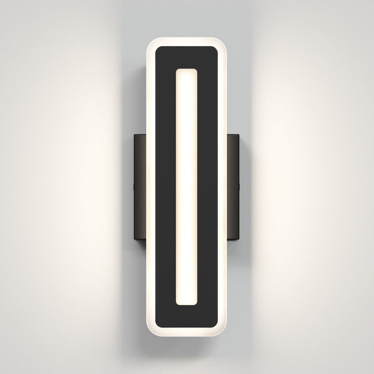 A modern rectangular wall sconce with a black central panel and a white illuminated border, mounted on a grey wall and casting soft light outward.
