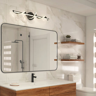 Modern bathroom with marble tile walls, wooden vanity, floating shelves, sleek black faucet, a large mirror topped by the Artika Coda 27-in Integrated LED Vanity Light Bar (5-CCT), and a walk-in shower reflected in the glass.