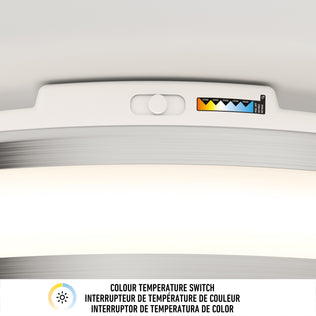 Close-up of Artika Hemisphere 15 in. LED Flush Mount’s color temp switch and multilingual adjustable brightness label.