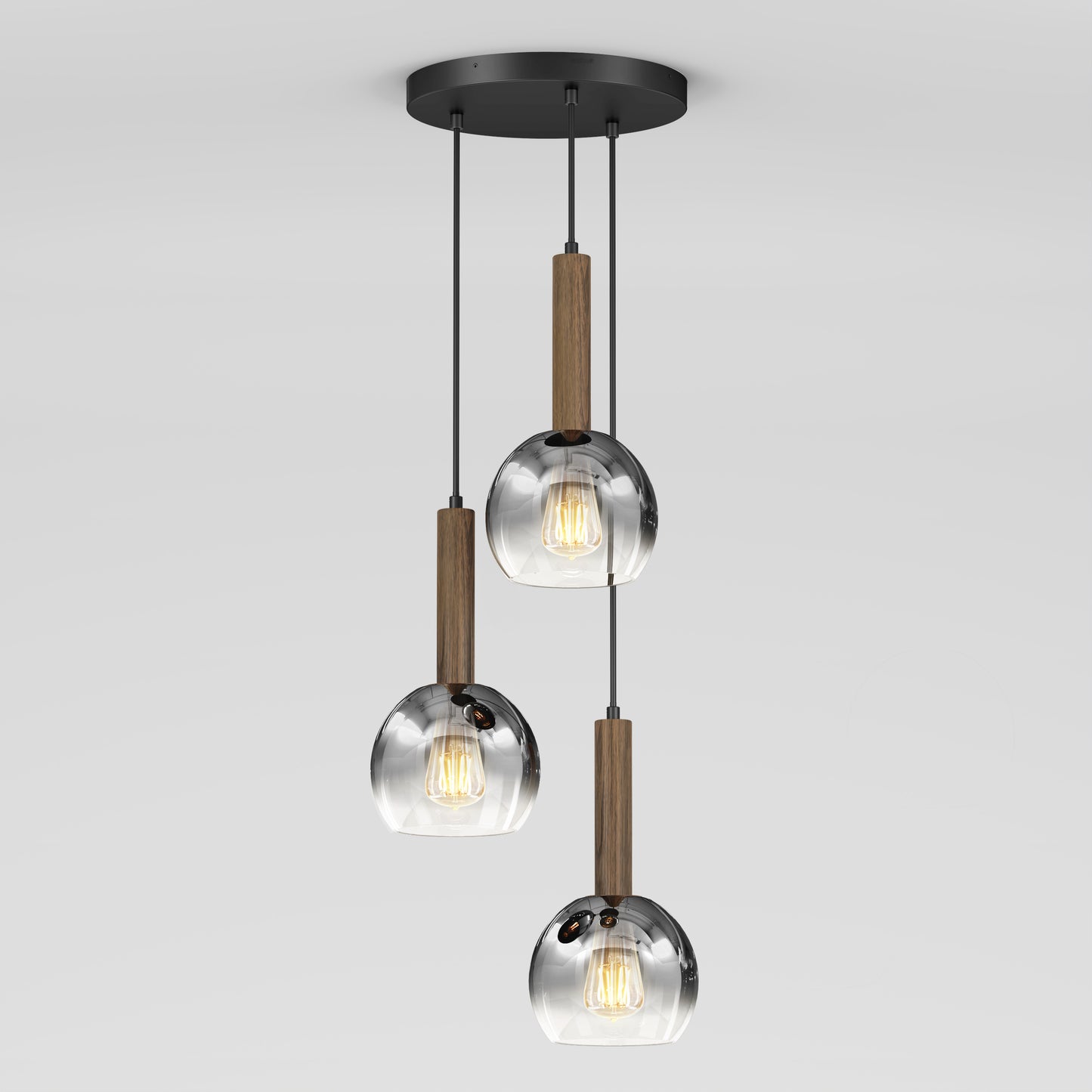 The Ardel Spiral 3-Light Pendant by Artika features three clear glass globes suspended by black cords with wooden accents from a round black ceiling mount; bulbs not included.