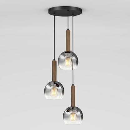 The Ardel Spiral 3-Light Pendant by Artika features three clear glass globes suspended by black cords with wooden accents from a round black ceiling mount; bulbs not included.
