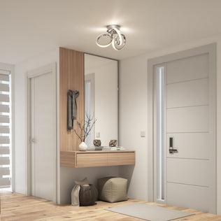 Modern entryway with a large mirror, console, poufs, baskets, and the Artika Swirl LED flush mount (1300 lumens) ceiling light.