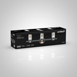 A black box with artika branding displays a three-light vanity fixture called Essence 3. The package shows images and features of the modern light, including LED technology and energy-efficient details.