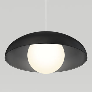 The Artika Boden LED modern mid-century pendant light features a black, wide, shallow dome shade and a glowing white bulb, suspended from a sleek black cord against a light gray background.