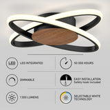 Modern ceiling light fixture with two intersecting LED rings, wood and black base. Infographic highlights: LED integrated, dimmable, 1300 lumens, 50,000-hour lifespan, selectable white technology, and easy installation.