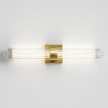 The Artika Dorado 27 in. 1-Light LED Wall Vanity offers dimmable, modern bathroom lighting with a brass accent and four glass rods.