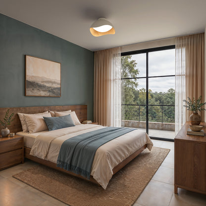 Adara 15 in. (38 cm) Modern LED Flush Mount Ceiling Light 5 CCT with a curved wooden accent.