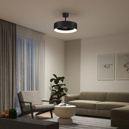 A modern living room with a beige sofa, armchair, round coffee table, potted plant, large window with sheer curtains, and an Artika Aiden 24 in. LED modern ceiling fan (3 speeds, remote control). Minimalist wall art decorates the wall.