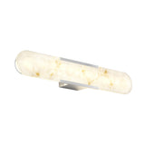 A modern wall-mounted light fixture with a frosted, marble-like, elongated oval shade and metallic accents, emitting a soft, warm glow.
