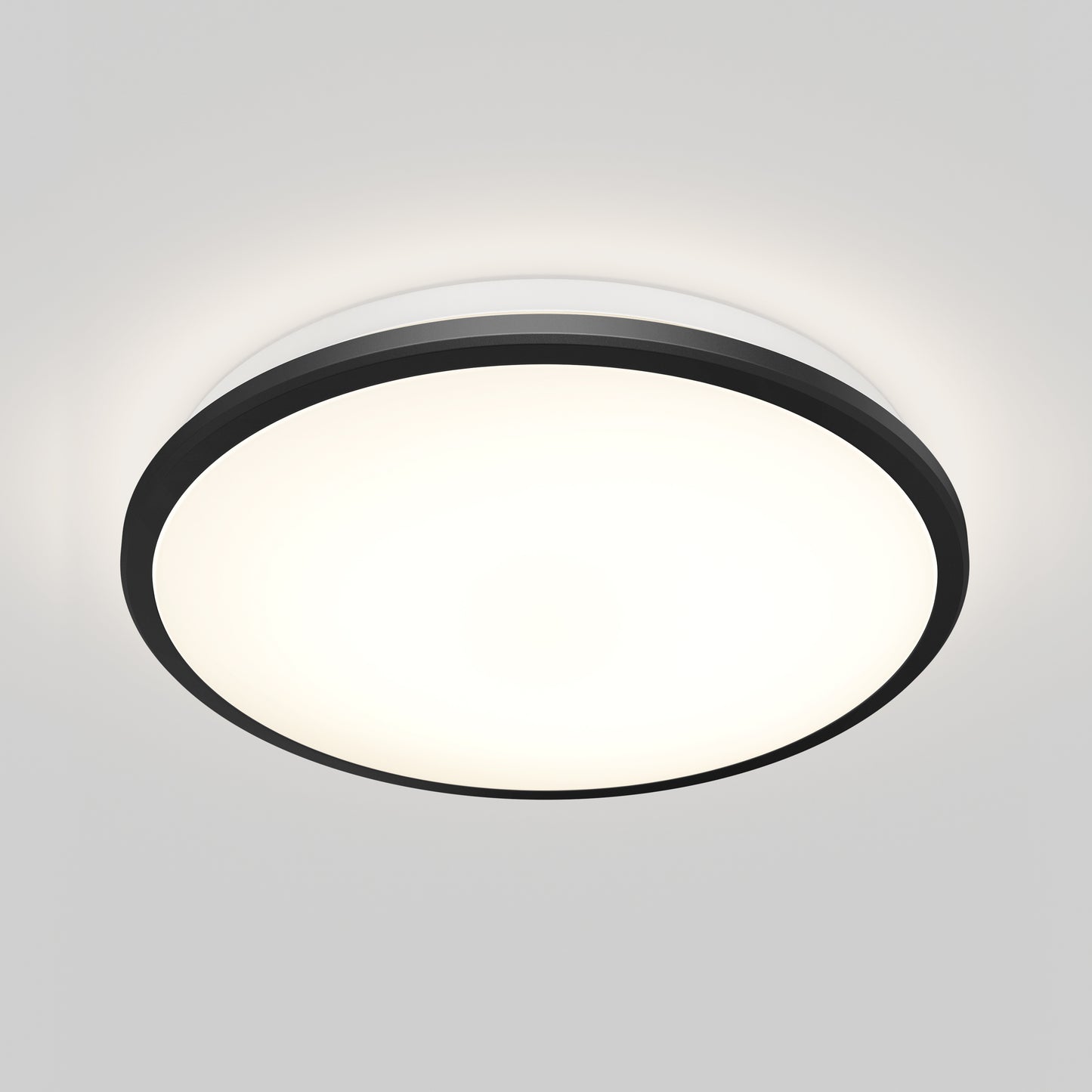 The Artika Vera 13 in. LED modern flush mount light features a black rim and bright white center, elegantly mounted on a plain white ceiling.