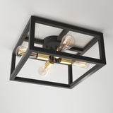 A modern ceiling light fixture with a black square metal frame, two exposed Edison-style bulbs, and brass accents, mounted on a white ceiling.