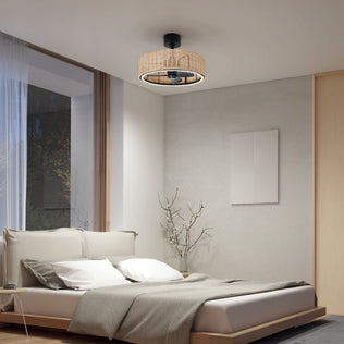 A modern bedroom featuring a low beige bed, neutral bedding, large window, minimalist decor, bare branch in a vase, abstract wall art, and an Artika Kalani 24 in. LED modern ceiling fan with 3 speeds and remote.