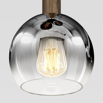 A close-up of the Artika Ardel Spiral 3-Light Pendant without bulbs, featuring a clear glass shade and wooden fixture, shown against a plain light background.