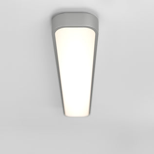 The Artika Europa 36 LED flush mount light, a modern rectangular fixture with rounded edges, emits a soft white glow on a plain white ceiling and comes with a remote.