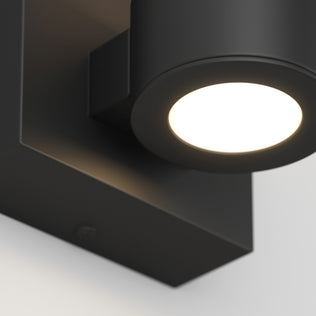A close-up of Artika's Essence 1-light LED bathroom vanity light, featuring a circular, dimmable accent glow.